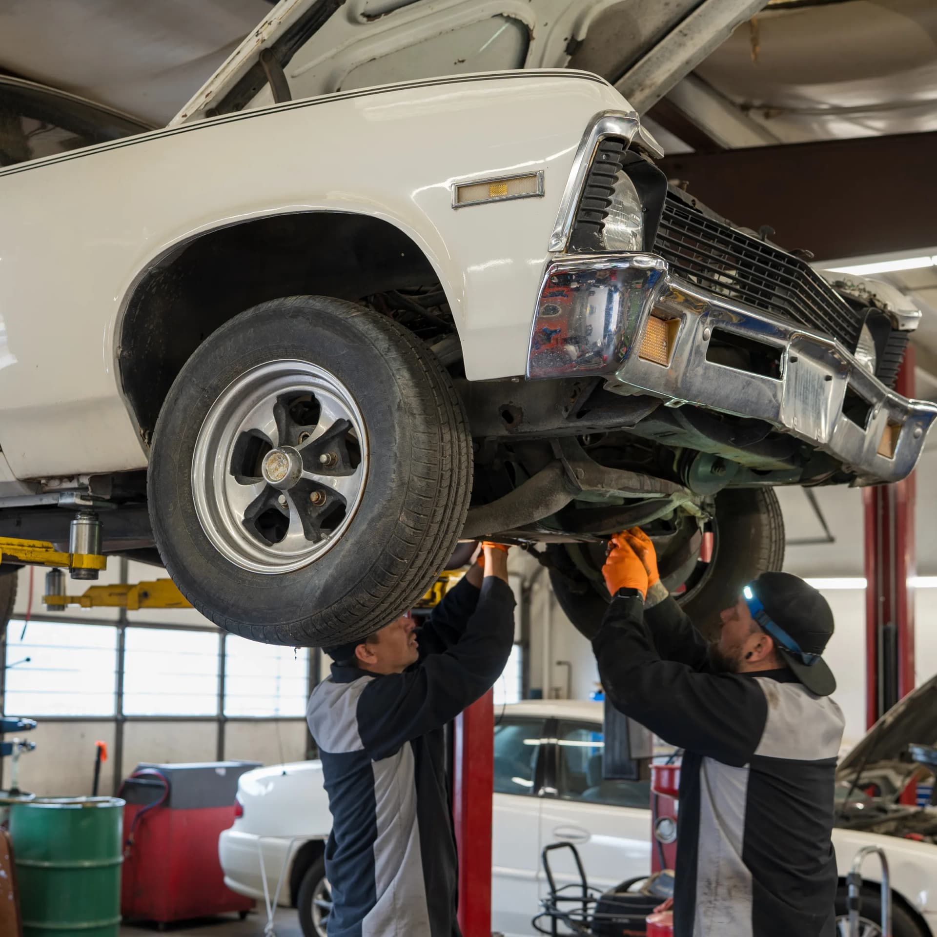 Classic car on lift at RKC Automotive in Englewood, Colorado