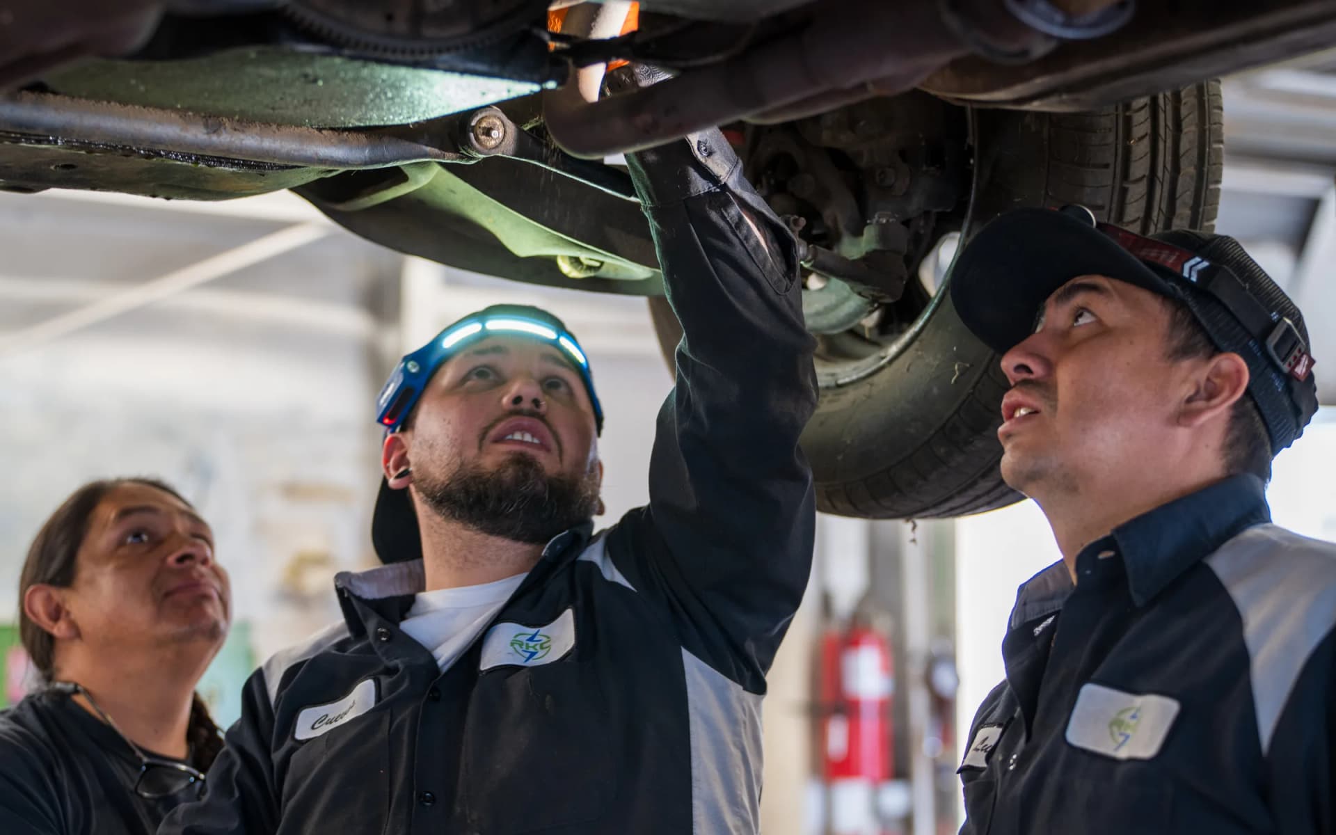 RKC technicians inspecting undercarriage