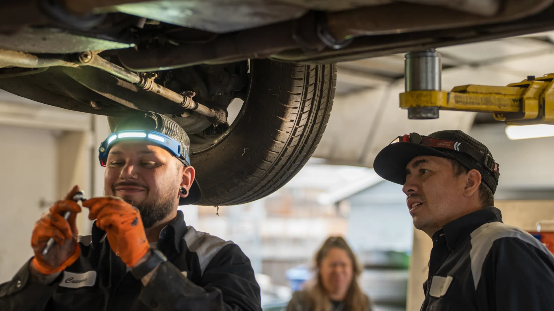 RKC Automotive ASE-certified technicians working together in Englewood